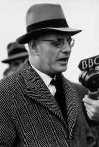 John Curtin speaking into microphone